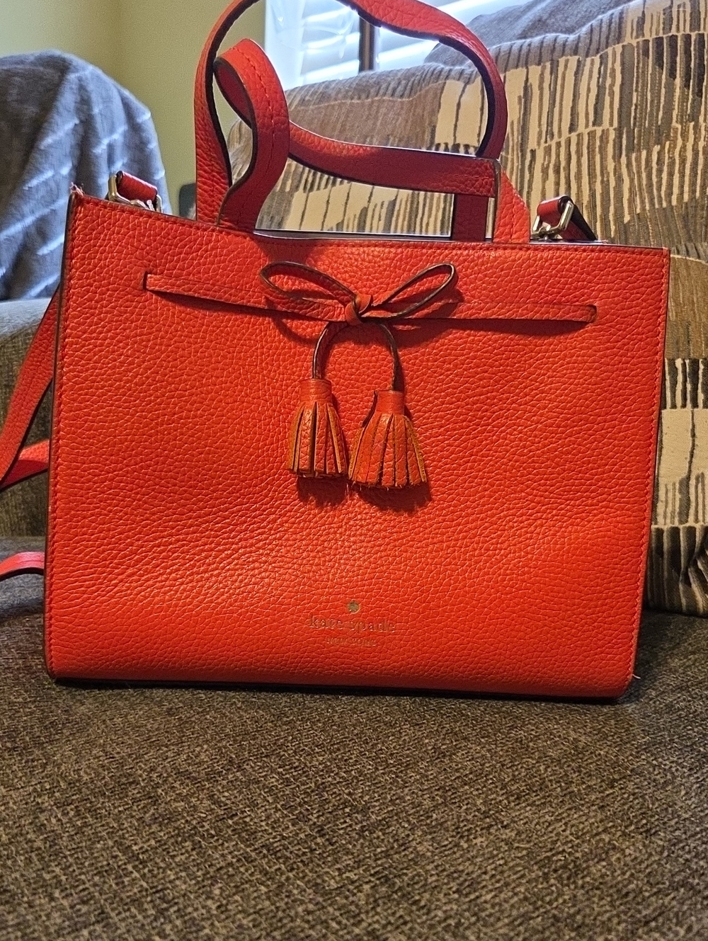 kate spade orange pebbled leather tote with tassel